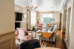 a living room with a couch and chairs at Althoff St James's Hotel & Club London in London