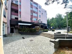 a large building with stairs in front of it at Apartment Meri with garage in Velika Kladuša