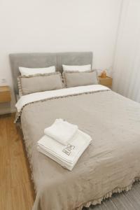 a bedroom with a bed with towels on it at Wild River 2 in Neporotovo +42 photos