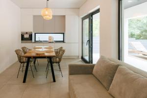 a living room with a table and a couch at Wild River 2 in Neporotovo