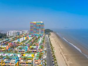 an aerial view of a beach with colorful buildings at Bản làng Home in Thanh Hóa