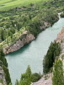 an aerial view of a river in a valley at Ak Bulak in Kurmenty