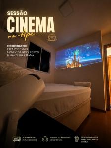 a poster of a bedroom with a bed and a tv at Apt Moderno e Confortavel 7 min do Centro em 7L in Sete Lagoas