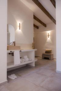 a bathroom with a sink and a mirror at Sant Blai Boutique Hotel - Javea in Jávea +88 photos
