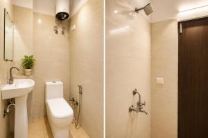 a bathroom with a toilet and a sink and a shower at Hotel Gold Ston Near Yashoda Hospital & Vaishali Metro in Ghaziabad