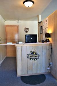 a wooden desk with a laptop on top of it at Royal Motel in Ironwood