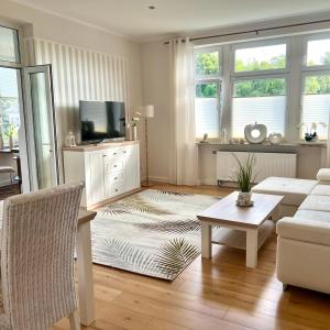 a living room with a couch and a table at Wellness-Oase-Nossen Kirchblick in Nossen