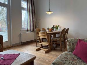 a dining room with a table and chairs at Dahmerhof in Dahme