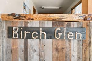 a sign that says bright green on a wooden wall at Birch Glen Hotel in Cascade +59 photos