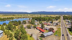 an aerial view of a small town with a river at Birch Glen Hotel in Cascade