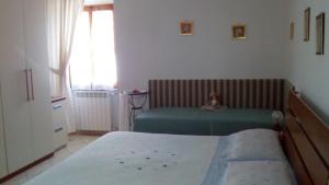 Posteľ alebo postele v izbe v ubytovaní Casa Michelangelo