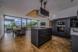 a kitchen with a table and a dining room at Edlgütl - Hideaway in Breitenberg