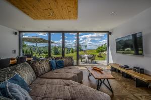 a living room with a couch and a table at Edlgütl - Hideaway in Breitenberg