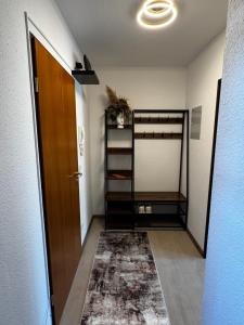 a hallway with a room with a door and a rug at Apartment Eppingen in Eppingen