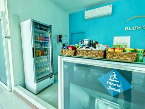 a store window with a fridge in a store at Blue Orchids Hotel in Hat Yai