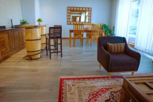 a living room with a table and a couch and chairs at Noora Resort Bishoftu in Debre Zeyit
