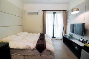 Телевизор и/или развлекательный центр в Ai Lian Shan Shui Homestay