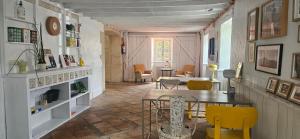 a living room with a table and chairs at Planazo House in Arnuero