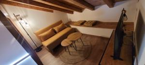 a living room with a couch and a table at A Bodega da Xesteira in Melón