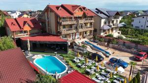 an aerial view of a resort with a swimming pool at Hypnotic Villa Pitesti in Piteşti