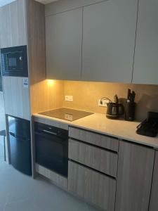 a kitchen with a sink and a stove top oven at Costa Royale APARTAMENT in Torrevieja