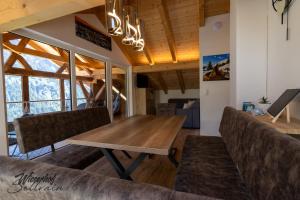 a dining room with a table and a couch at Wieserhof Sellrain in Sellrain