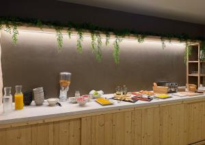 a buffet line with food and drinks on it at Bytra Boutique Hotel - Adults Only in Petra