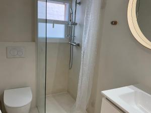 a bathroom with a shower with a toilet and a sink at Es Pujols Vista Mare in Es Pujols +42 photos