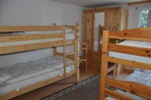 a room with two bunk beds and a mirror at Immeuble La Foret in Vex