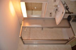 a bathroom with a sink and a bath tub at Immeuble La Foret in Vex