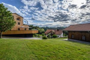 a house with a large yard with a building at Edlgütl - Hideaway in Breitenberg