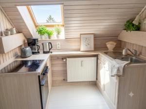 a small kitchen with a sink and a stove at Ein Zuhause auf Zeit in Osterburg