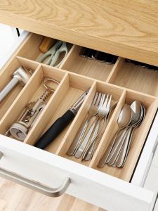 a drawer filled with utensils in a cabinet at Liedagas in Kolka