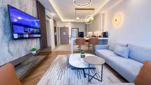 a living room with a couch and a table at Hiper Suites Residance in Antalya +35 photos