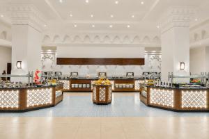 a buffet line in the lobby of a hotel at Continental Plaza Beach Resort in Sharm El Sheikh +203 photos