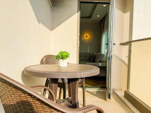 a table with a potted plant on it in a room at Hiper Suites Residance in Antalya