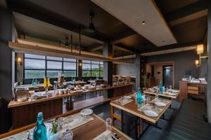 a dining room with tables and counters at Cliff and Cloud Vagamon in Vagamon