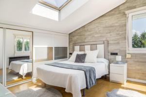 a bedroom with two beds and a window at Villa Romeo in Oviedo +37 photos