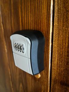 a close up of a door knob on a wooden door at J&K Apartments in Brocēni