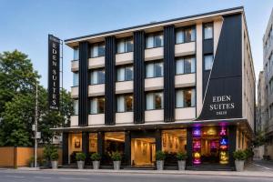 a building with a sign that reads eden suites hotel at Hotel Eden Suites Delhi Airport in New Delhi