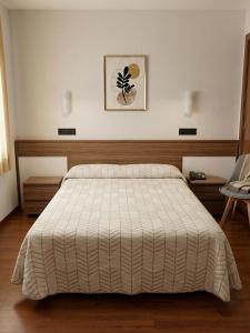 เตียงในห้องที่ Hotel Pelayo