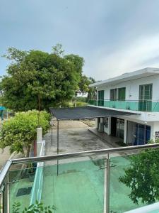 a view from the balcony of a building with a swimming pool at Habitaciones Melany in Coveñas