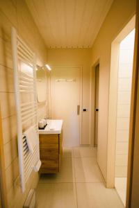 a bathroom with a sink and a mirror at L'Oustal des Dômes in Orcines +57 photos