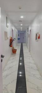 an empty hallway with a long hallway at Wavelength Hotel and uites in Ibadan +1 photo