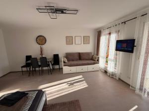 a living room with a couch and a table at Apartment Eppingen in Eppingen