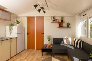a living room with a couch and a table at Bol Cutie in Murvica +25 photos