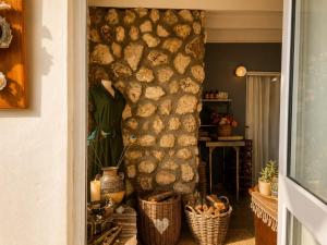 a room with a wall filled with logs at Tanzanite in Paternoster