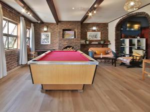 a living room with a pool table in it at Secret Sands Glenmore Beach in Port Edward
