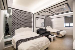 Кровать или кровати в номере Ai Lian Shan Shui Homestay