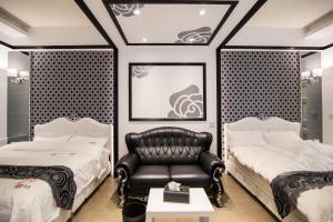 Кровать или кровати в номере Ai Lian Shan Shui Homestay